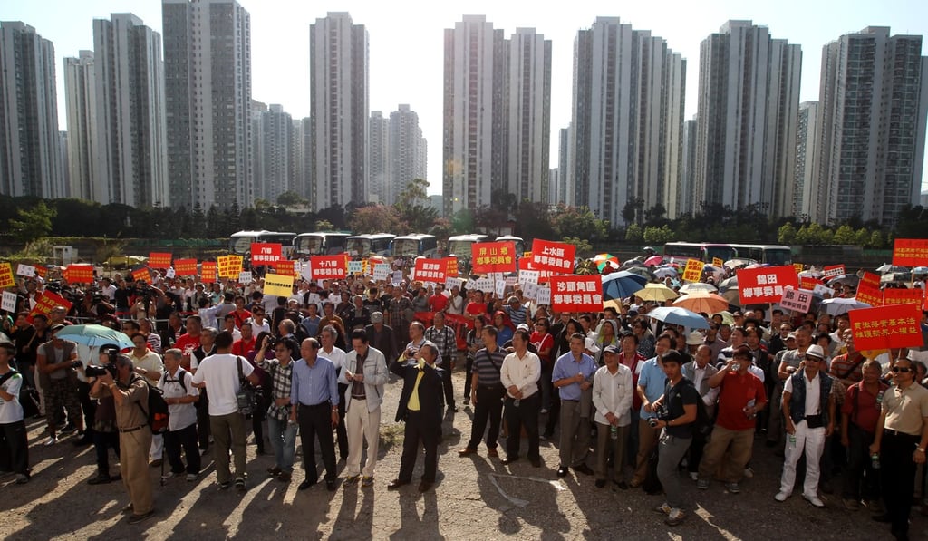 Villagers protest against a government initiative on handling unauthorised building works in New Territories village houses, outside the Sha Tin Heung Yee Kuk building in November 2011. Photo: Felix Wong