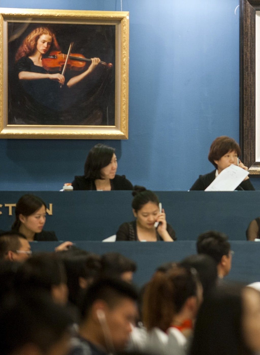 Mainland auction houses say they are benefiting from the crackdown on capital outflow.