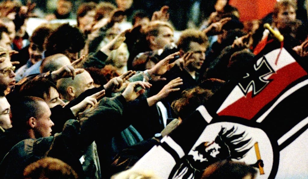 German Neo-Nazis give their salute. They can march in Germany, but face a battery of rules from the authorities. Photo: Reuters