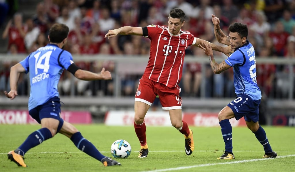 Bayern Munich’s Robert Lewandowski (centre) and Bayer Leverkusen’s Admir Mehmedi (left) and Charles Mariano Aranguiz. Photo: AP Bayern Munich’s Robert Lewandowski (centre) and Bayer Leverkusen’s Admir Mehmedi (left) and Charles Mariano Aranguiz. Photo: AP