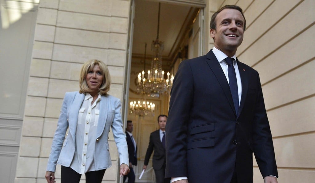 This file photo taken on July 25 shows French President Emmanuel Macron and his wife Brigitte Macron arriving to attend a concert by the Pierre Claver Association at the Elysee Palace in Paris. Photo: AFP