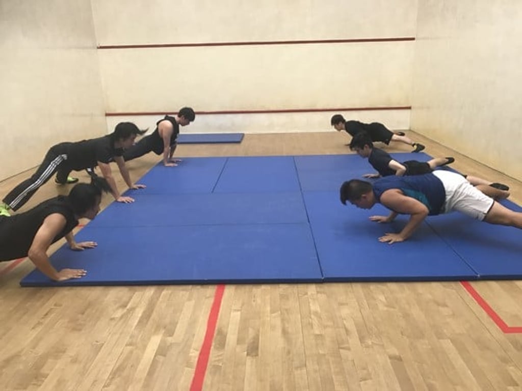 Ho Ho Lun (second left) trains with his class at the Pei Ho Street Sports Centre in Sham Shui Po. Photo: Nicolas Atkin