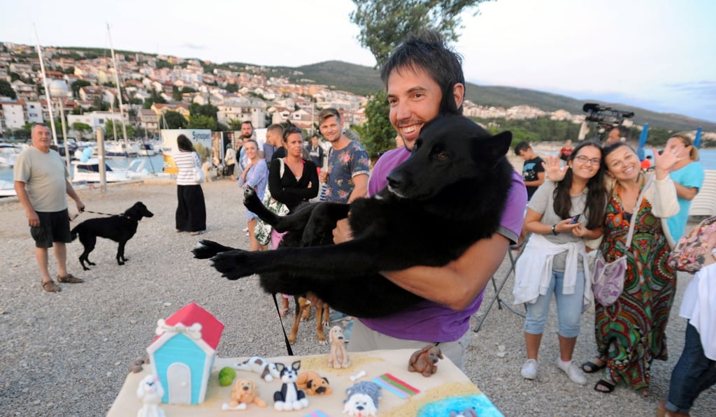 Marin poses with his dog Nimbus after they won the “Underdog 2017” beach race in Crikvenica, Croatia, on Sunday. Photo: Reuters