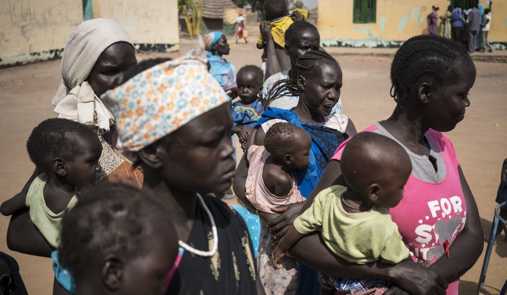 Mothers wait to have their children screened for malnutrition at a Unicef-supported outpatient programme in Aweil, South Sudan, on March 13. The young country has been battling both civil war and famine. Photo: AP