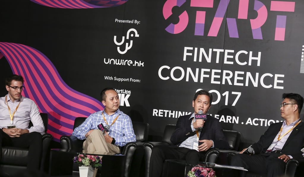 Sammy Kam, technical director at Octopus Holdings, addresses the START FinTech conference 2017, as Gatecoin founder-CEO Aurelien Menant, HSBC’s digital experience chief Sean Seah and Peter Koo, partner of advisory in audit at Deloitte China, look on, at the Hong Kong Convention and Exhibition Centre on July 27. Photo: Jonathan Wong