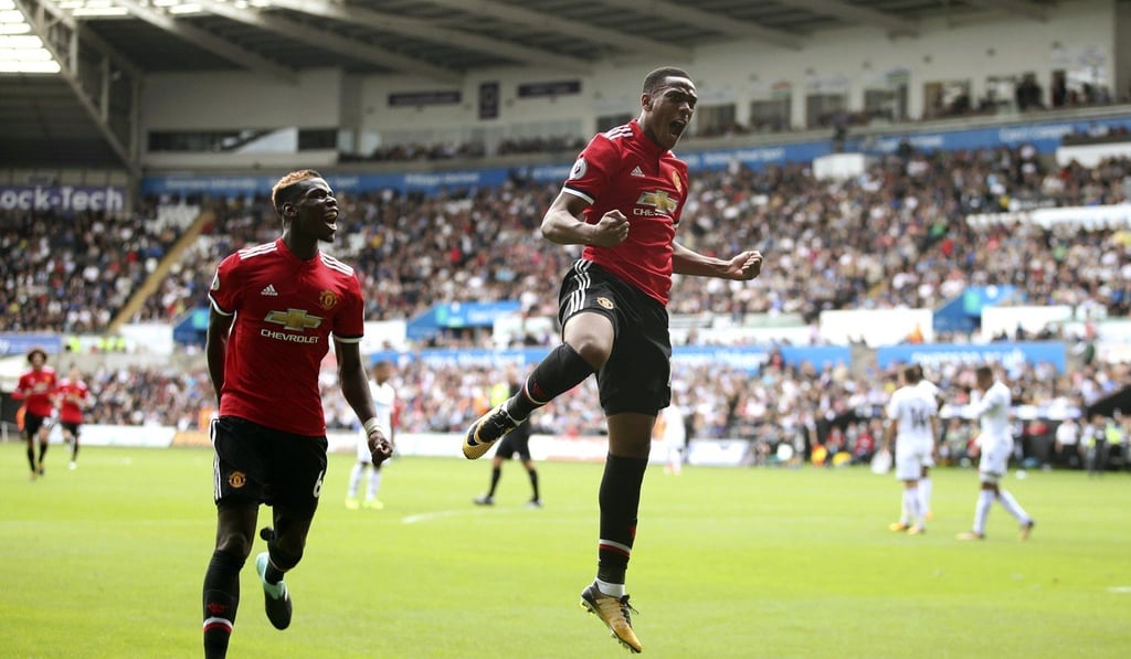 Paul Pogba set up Anthony Martial (right) for his goal in the 4-0 win at Swansea. Photo: AP Paul Pogba set up Anthony Martial (right) for his goal in the 4-0 win at Swansea. Photo: AP