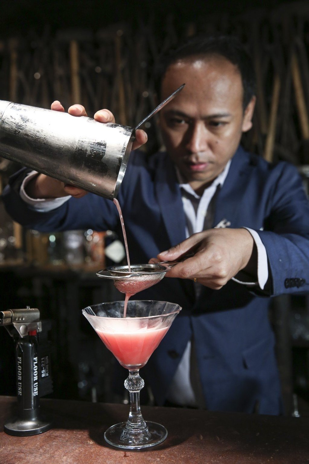 Mixologist Sanam Pakhrin prepares a Watermelon Daiquiri with a fairy dust burnt marshmallow at Iron Fairies. Photo: SCMP / Sam Tsang