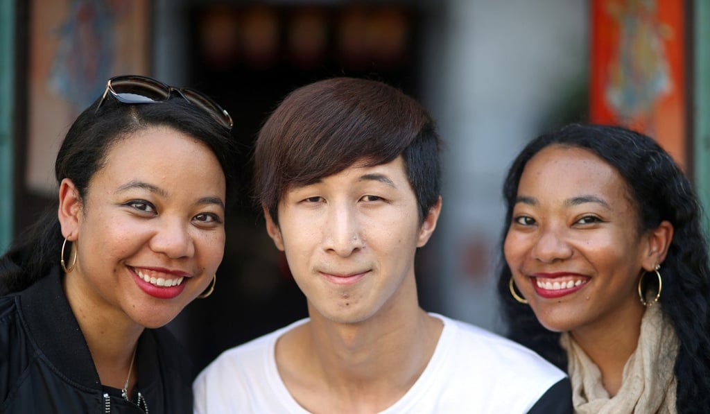 Tao Leigh Goffe, Yau Hing-lung, and Gaia Goffe at Yau's house in Fan Leng Lau Village. Yau is a Hong Kong native, while his cousins are Jamaican Chinese.