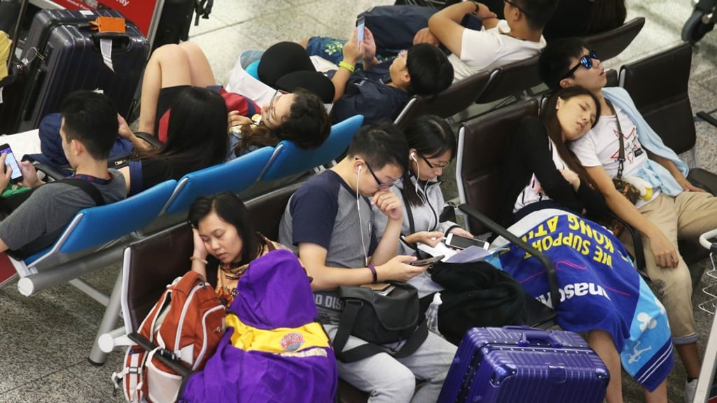 Stranded passengers at the Hong Kong International Airport. Photo: K. Y. Cheng