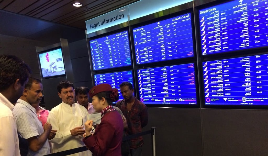 In this June file photo, passengers of cancelled flights wait in Hamad International Airport in Doha, Qatar after Saudi Arabia and other Arab powers severed diplomatic ties with Qatar and moved to isolate the energy-rich nation. Photo: AP