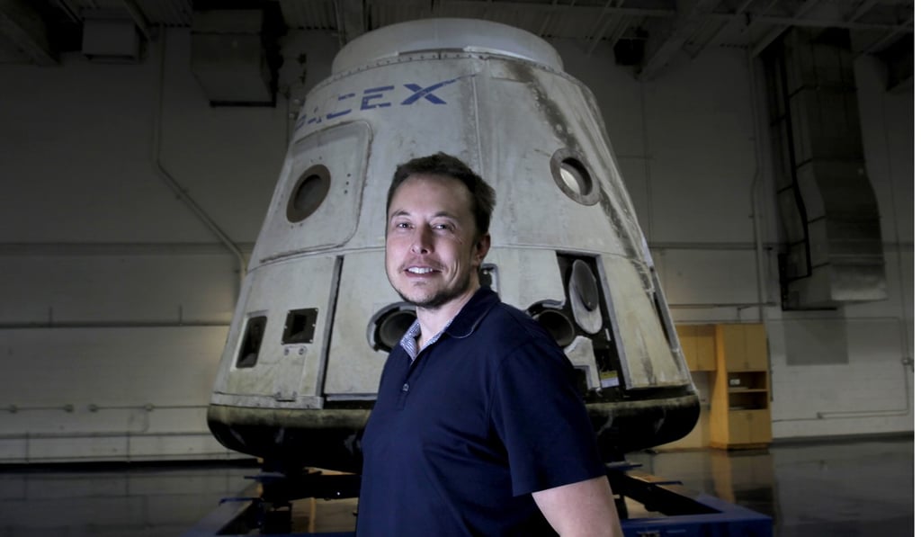 SpaceX founder Elon Musk stands in front of the SpaceX Dragon capsule. Photo: TNS