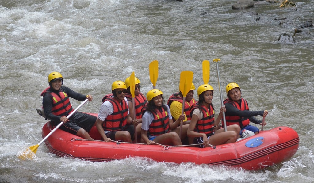 Former US president Barack Obama and his family on a Four Seasons raft in Bali in June. Picture: AFP