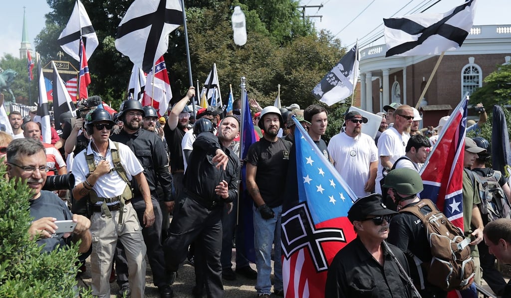 White nationalists, neo-Nazis, Ku Klux Klan and members of the “alt-right” during a “Unite the Right” rally in Charlottesville on August 12 that later turned violent. Photo: AFP White nationalists, neo-Nazis, Ku Klux Klan and members of the “alt-right” during a “Unite the Right” rally in Charlottesville on August 12 that later turned violent. Photo: AFP