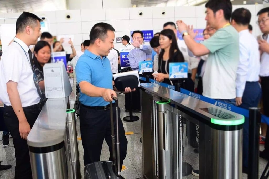 Passengers are boarding at the Jiangying Airport in Nanyang of Henan province by having their faces scanned in lieu of using boarding passes. The airport supported by BaiduÕs technologies is ChinaÕs first to allow passengers to board with the support of facial recognition. Photo: Handout Passengers are boarding at the Jiangying Airport in Nanyang of Henan province by having their faces scanned in lieu of using boarding passes. The airport supported by BaiduÕs technologies is ChinaÕs first to allow passengers to board with the support of facial recognition. Photo: Handout
