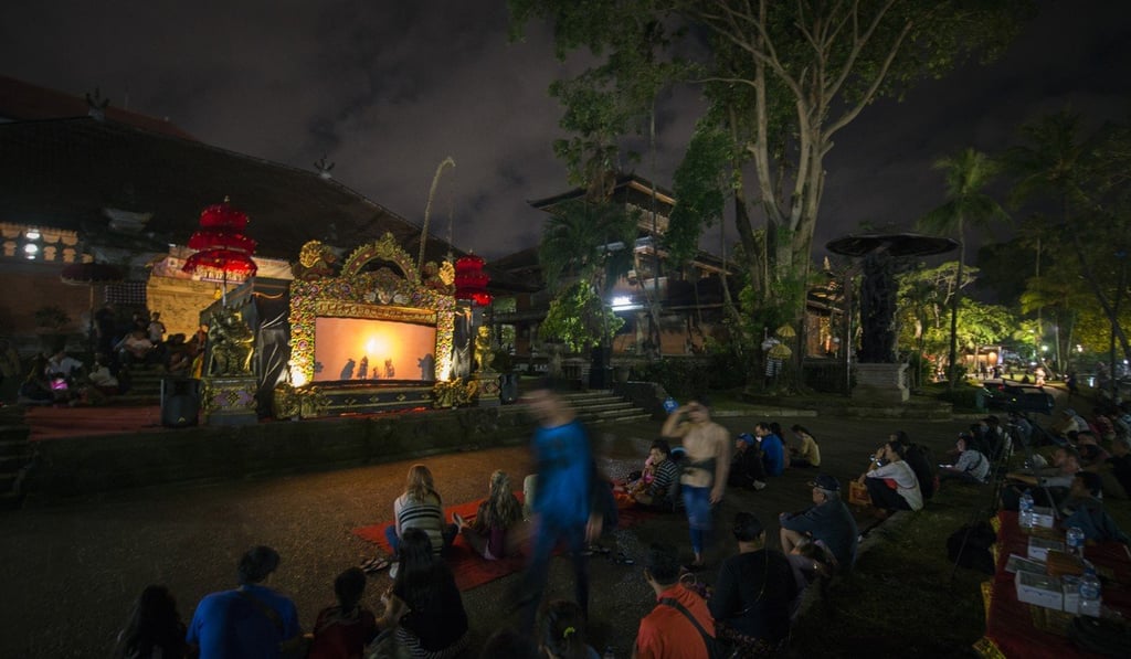 A shadow puppet show at the Denpasar Art Centre (also known as the Taman Werdhi Budaya Art Centre) draws crowds both young and old. Photo: David Burden