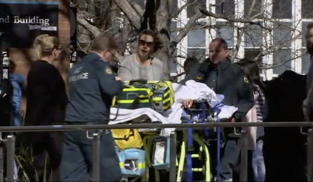 Injured students are attended to at Australian National University. Photo: AP Injured students are attended to at Australian National University. Photo: AP