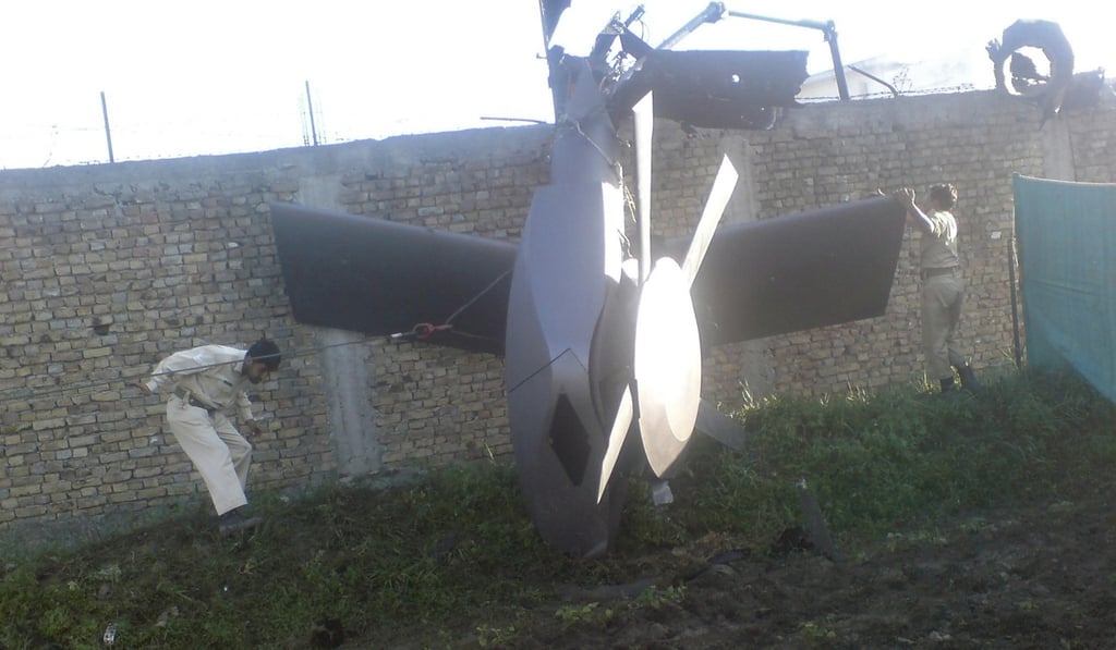 Part of a damaged US helicopter left at the scene of the Navy Seal raid on Osama bin Laden’s compound in Abbottabad. Photo: Reuters