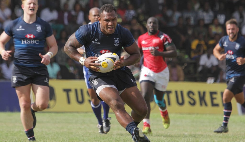 Hong Kong centre Lex Kaleca takes possession against Kenya.