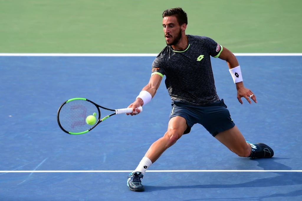 Damir Dzumhur returns a shot to Roberto Bautista Agut of Spain. Damir Dzumhur returns a shot to Roberto Bautista Agut of Spain.