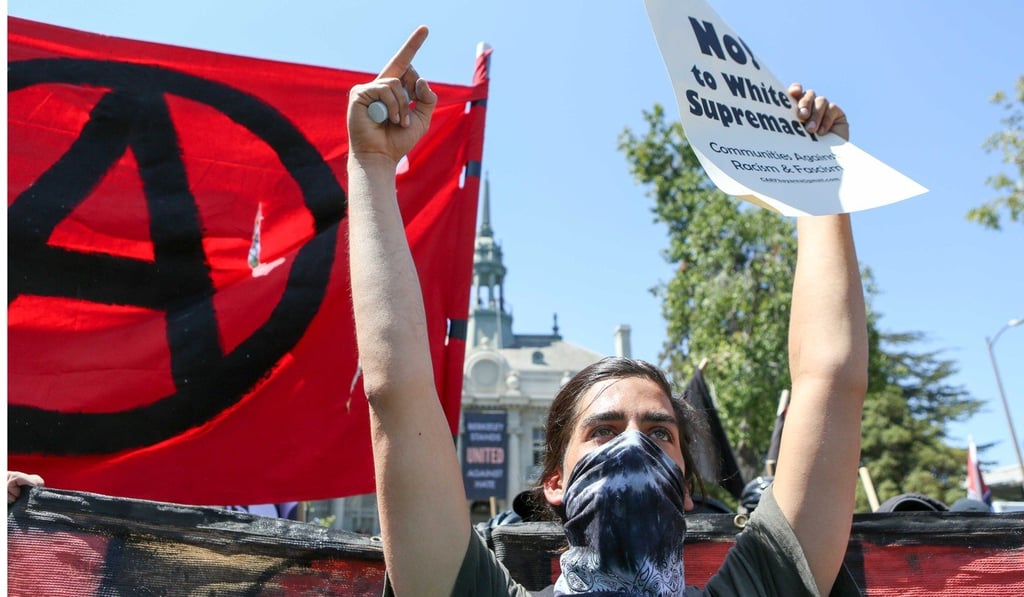 Antifa members and counter protesters gather during a rightwing No-To-Marxism rally on Sunday in Berkeley, California. Photo: AFP Antifa members and counter protesters gather during a rightwing No-To-Marxism rally on Sunday in Berkeley, California. Photo: AFP