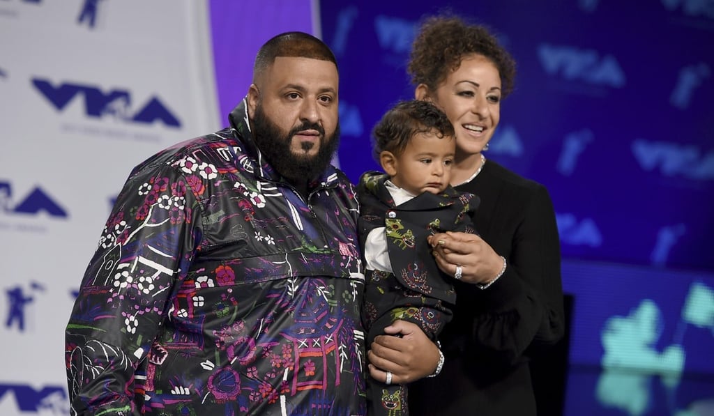 DJ Khaled, left, Nicole Tuck, right, and their son Asahd arrive at the MTV Video Music Awards. Photo: AP