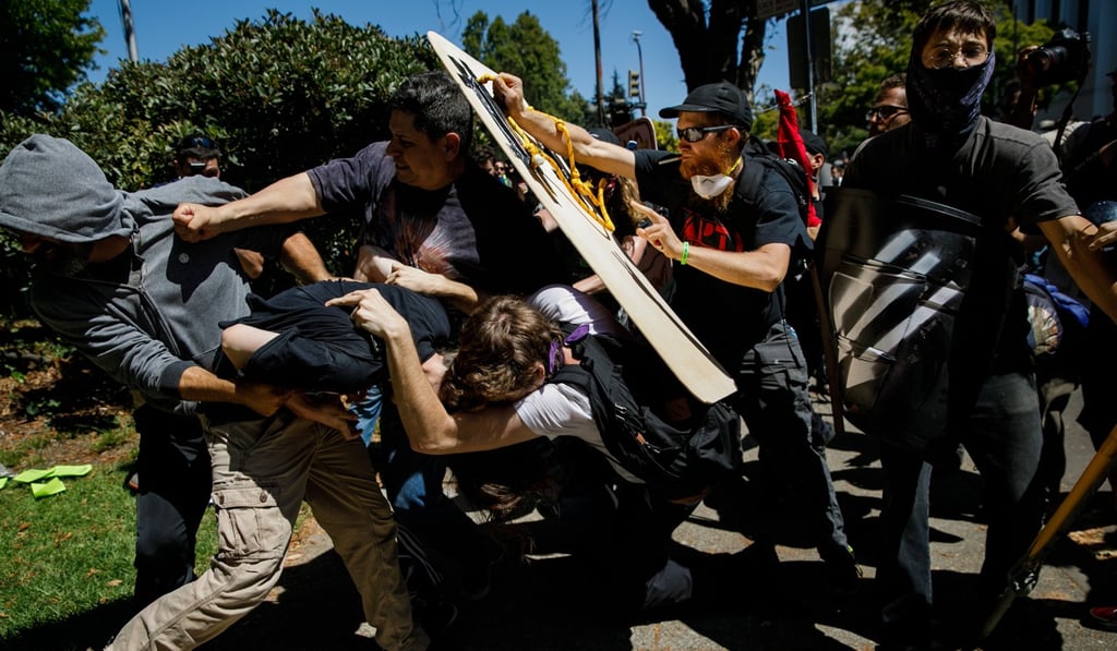 Demonstrators clash at Martin Luther King Park in Berkeley, California, on Sunday. Photo: TNS Demonstrators clash at Martin Luther King Park in Berkeley, California, on Sunday. Photo: TNS