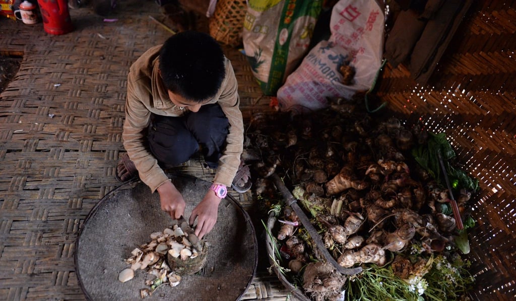 A teenager prepares food in the western Yunnan highlands, one of the poorest areas of the country. Photo: Xinhua A teenager prepares food in the western Yunnan highlands, one of the poorest areas of the country. Photo: Xinhua