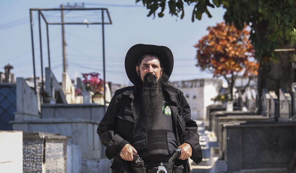 Police officer Luiz Machado, aka ‘Luiz Beleza’ attends the funeral of Sergeant Fabio Cavalcante. PhotoL AFP Police officer Luiz Machado, aka ‘Luiz Beleza’ attends the funeral of Sergeant Fabio Cavalcante. PhotoL AFP