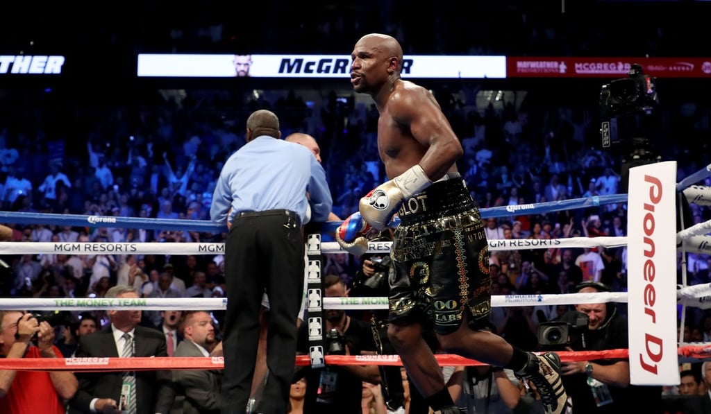 Referee Robert Byrd (left) stops the fight in round 10. Photo: AFP