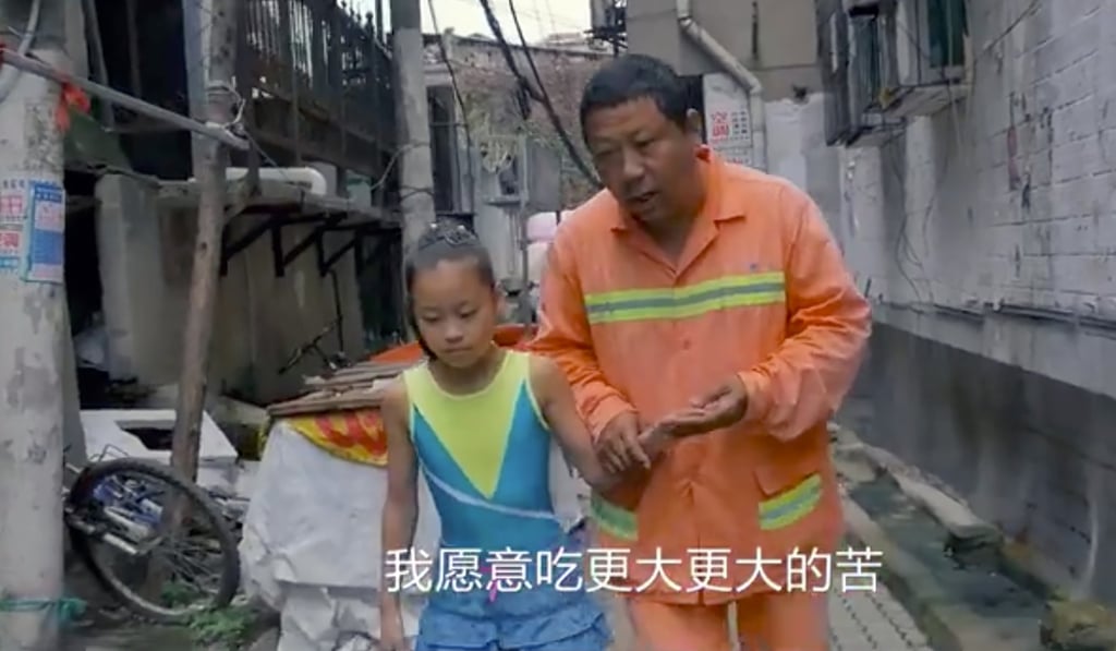 Hou gives his daughter a pep talk as she heads off to gymnastics school. Photo: Handout