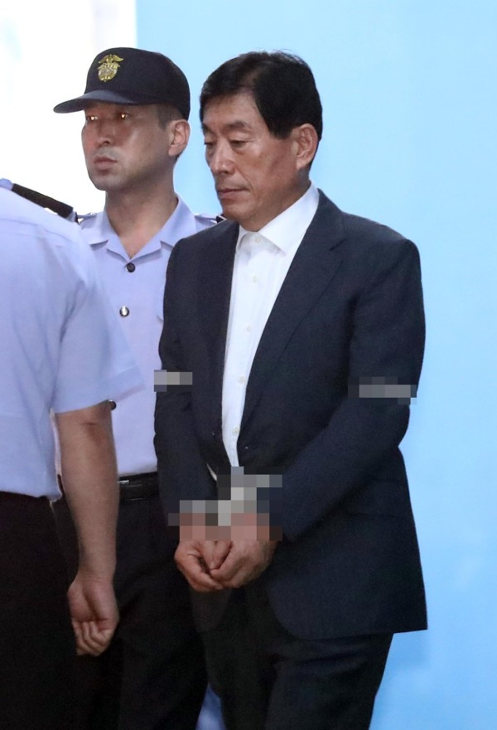 Won Sei-hoon, former director of the South Korean National Intelligence Agency, enters Seoul High Court on August 30, 2017. Photo: EPA/pixelated at source Won Sei-hoon, former director of the South Korean National Intelligence Agency, enters Seoul High Court on August 30, 2017. Photo: EPA/pixelated at source