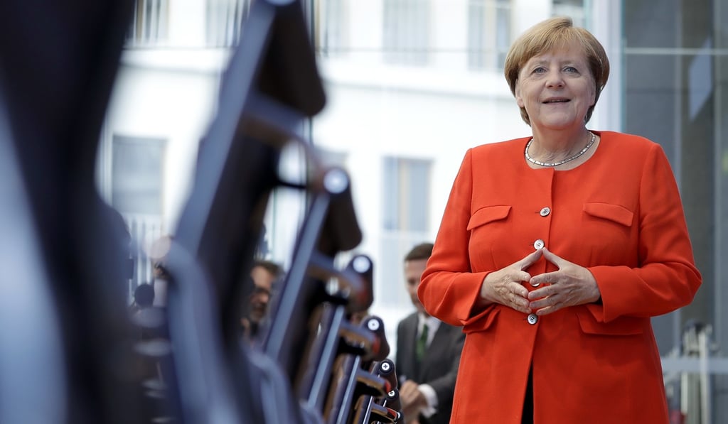 German Chancellor Angela Merkel poses for the media as she arrives for her annual press conference in Berlin on Tuesday. The Trump administration has targeted Germany, along with China, for its trade surpluses with the US. Photo: AP