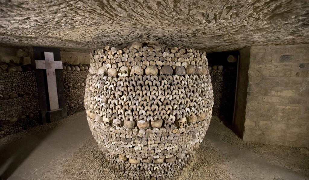 Skulls and bones are stacked at the Catacombs in Paris. French police say robbers broke into a wine collector's Paris cellar while he was away on vacation, breaking through the cellar wall via the Catacombs. Photo: AP