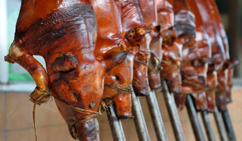 Suckling pigs on spits in the Philippines. Photo: Alamy