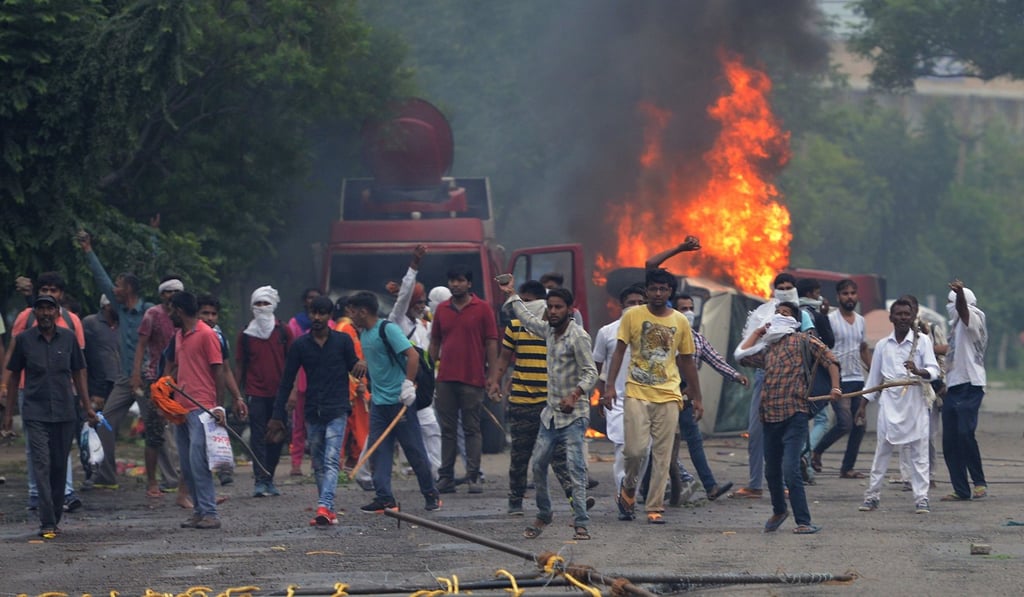 Supporters of Indian religious leader Ram Rahim riot in Panchkula after his conviction for rape. Photo: AFP Supporters of Indian religious leader Ram Rahim riot in Panchkula after his conviction for rape. Photo: AFP