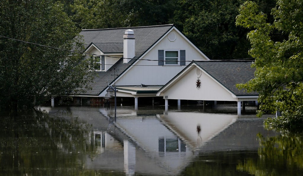 A house is surrounded by floodwaters from Tropical Storm Harvey in Rose City, Texas, on Thursday. Photo: Reuters