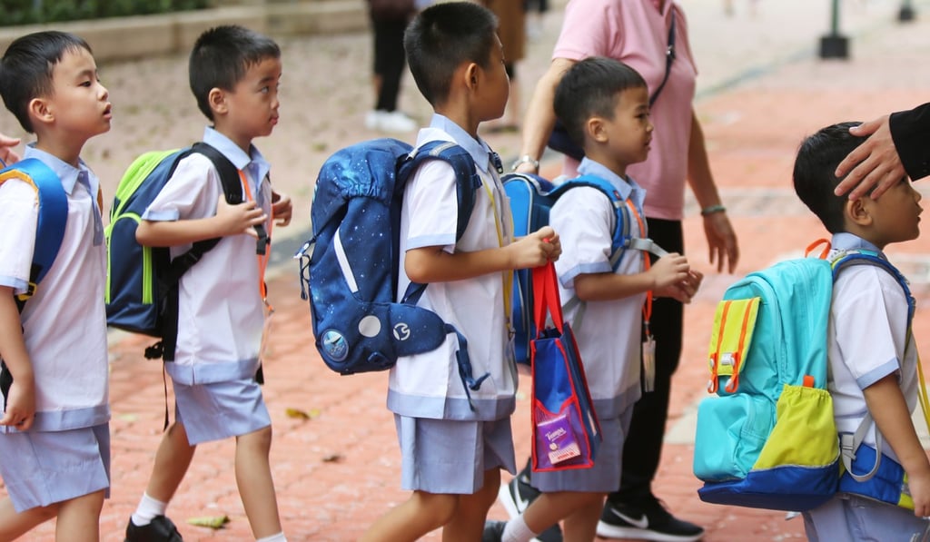 Pupils head to school on the first day of the new academic year on Friday. Photo: Xiaomei Chen