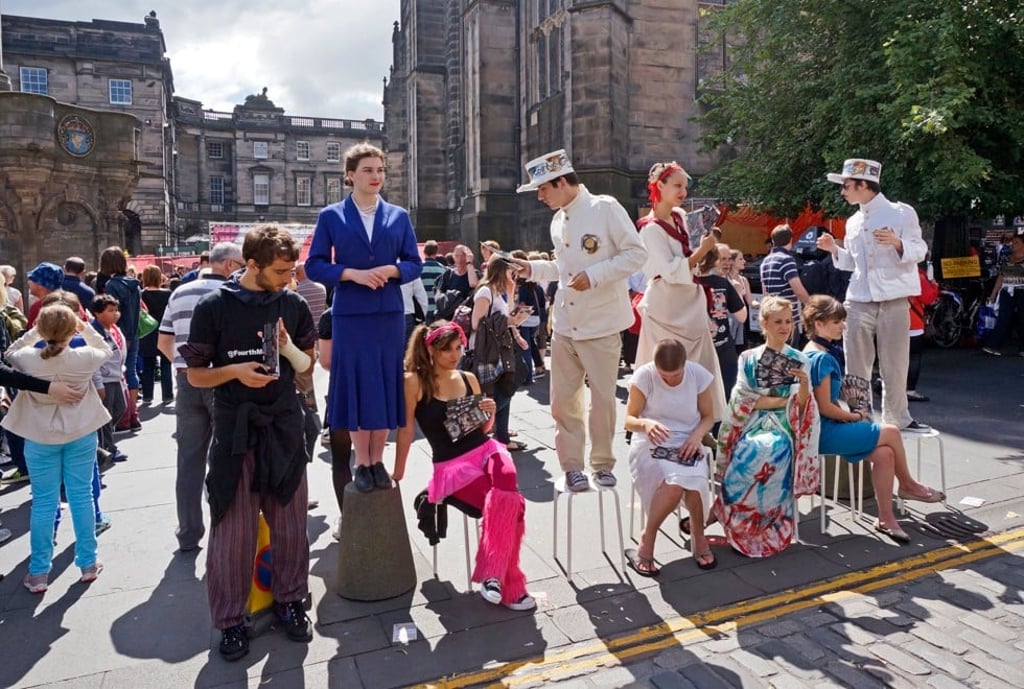 Edinburgh Fringe performers promote shows on the Royal Mile. Picture: Alamy