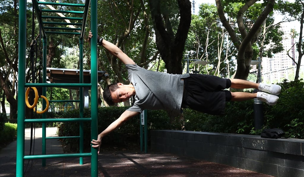 Nicholas Wong demonstrates his signature move, the human flag, at Victoria Park, Causeway Bay. Photo: Nora Tam
