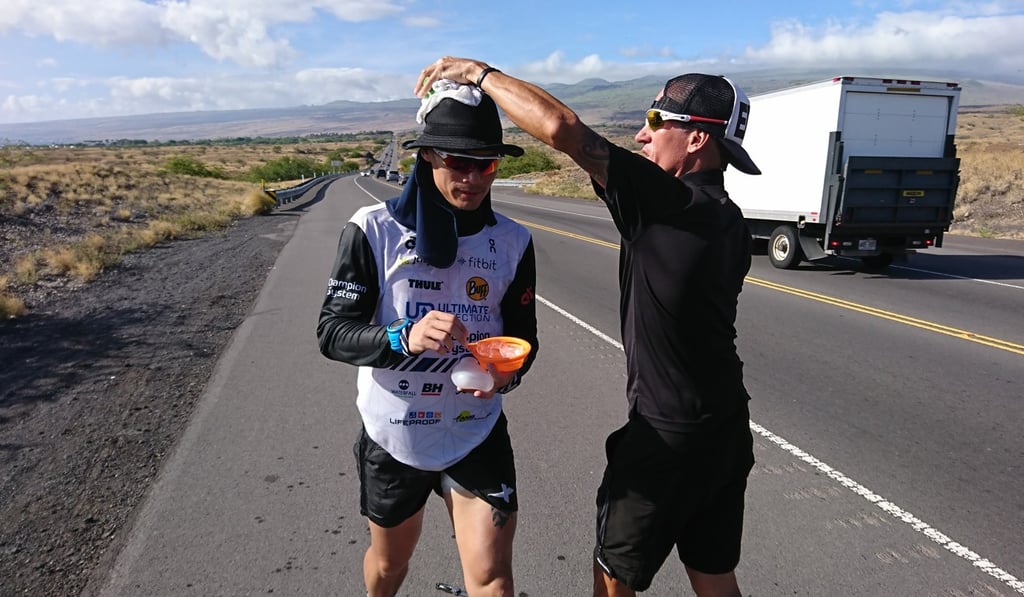 Wong eats on the run as he is assisted by mentor Jason Lester.