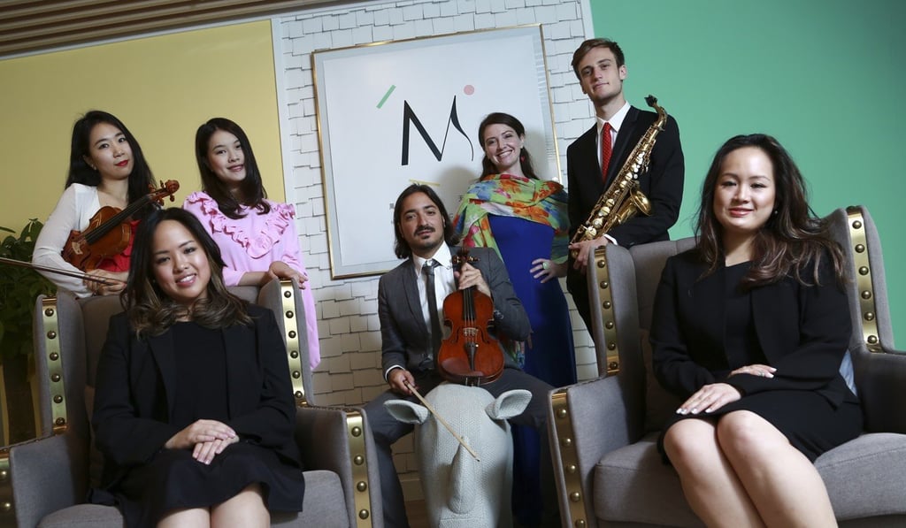 Philippa and Andrea with the teachers at M.int Academy.