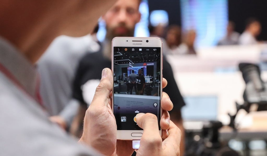 A staff member displays a cellphone at the booth of Huawei during the 2017 IFA consumer electronics fair in Berlin on September 1, 2017. Photo: Xinhua A staff member displays a cellphone at the booth of Huawei during the 2017 IFA consumer electronics fair in Berlin on September 1, 2017. Photo: Xinhua