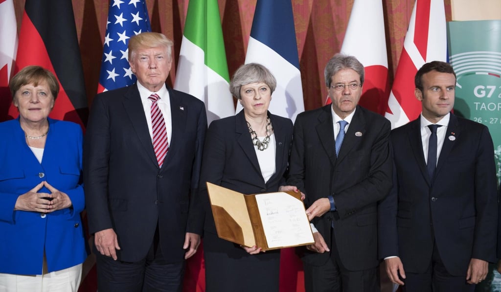 A selection of G-7 leader, from left: German Chancellor Angela Merkel, US President Donald Trump, British Prime Minister Theresa May, Italian Prime Minister Paolo Gentiloni and French President Emmanuel Macron, during a meeting on the first day of the G7 Summit in Sicily, Italy, in May 2017. Photo: EPA