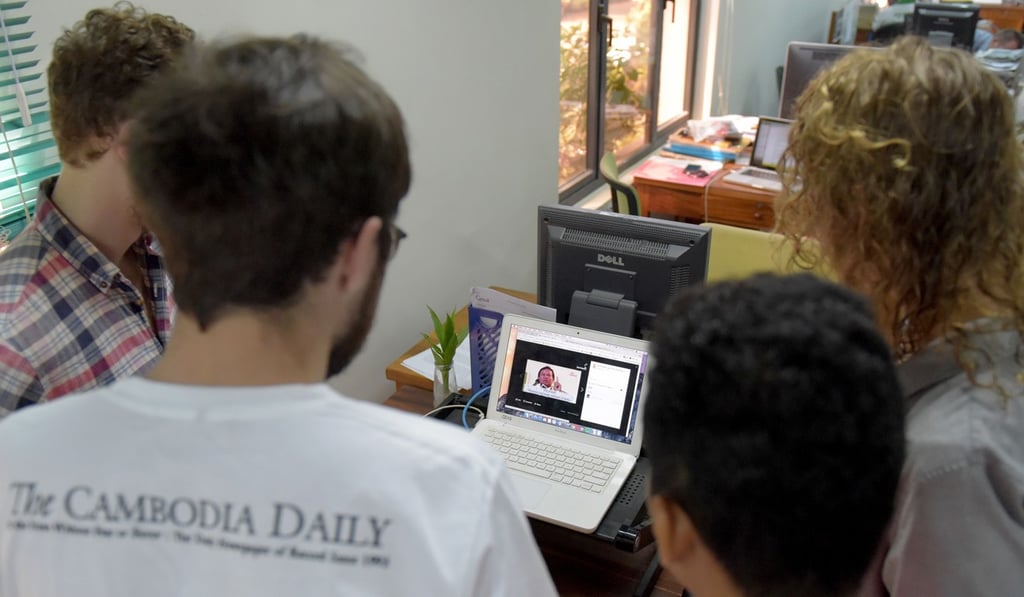 Reporters of the English-laguage newspaper Cambodia Daily watch a video clip featuring Cambodian opposition leader Kem Sokha at their newsroom in Phnom Penh. Photo: AFP Reporters of the English-laguage newspaper Cambodia Daily watch a video clip featuring Cambodian opposition leader Kem Sokha at their newsroom in Phnom Penh. Photo: AFP