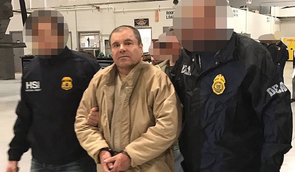 Joaquin Guzman is escorted by Mexican police as he is extradited to the United States. File photo: AFP