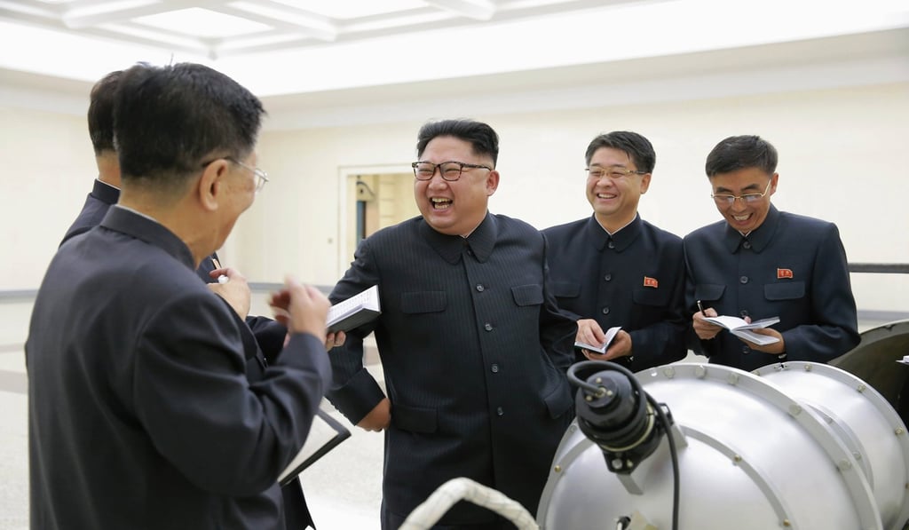North Korean leaser Kim Jong-un inspects a device purportedly part of its nuclear programme. Photo: EPA