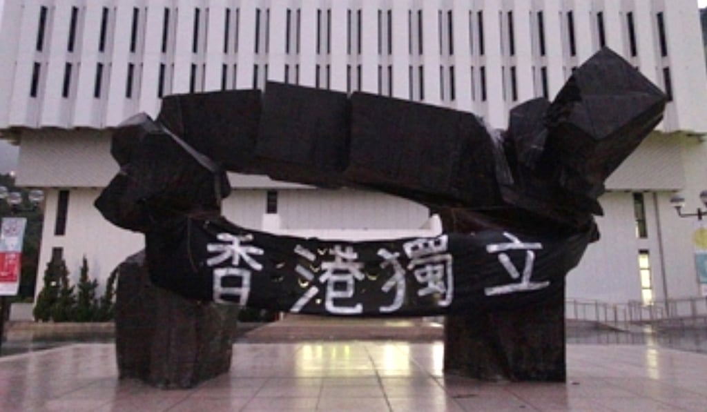 A banner draped a sculpture on campus known as ‘The Beacon’. Photo: Handout A banner draped a sculpture on campus known as ‘The Beacon’. Photo: Handout