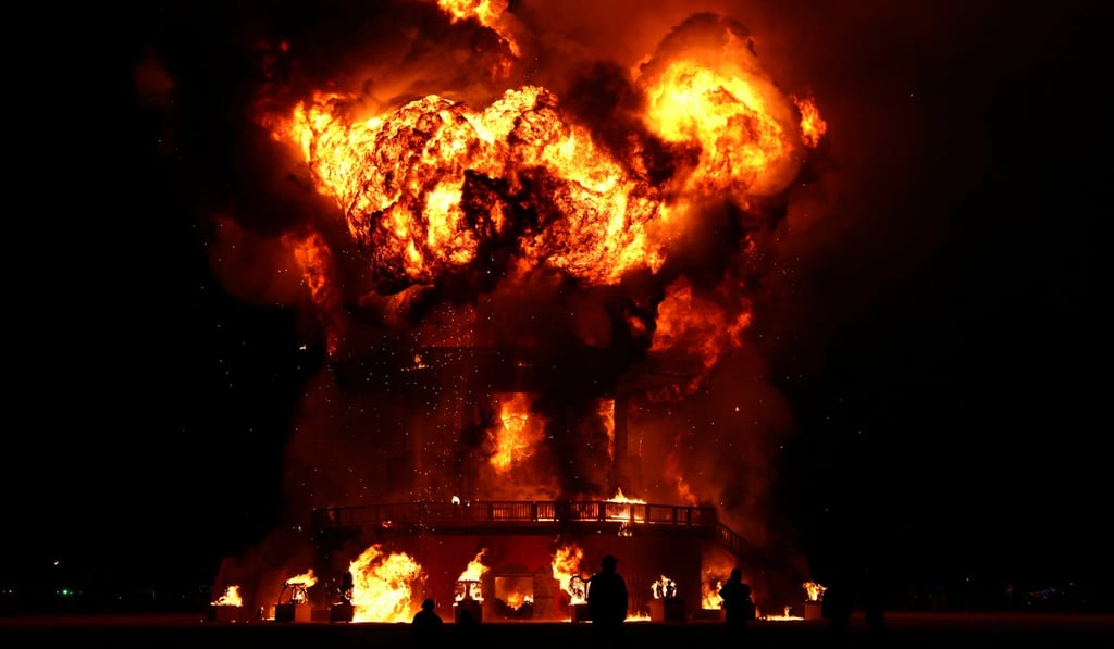 The effigy known as The Man bursts into the flames at the culmination of the annual Burning Man arts and music festival in the Black Rock Desert of Nevada on Saturday night. Photo: Reuters