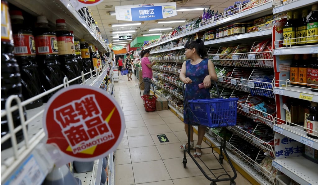 A woman shops for groceries at a supermarket in Beijing. China is set to require stricter certification for all food imports, irrespective of health risks. The proposed regulations threaten to make imports for smaller and medium-sized companies unprofitable. Photo: Reuters