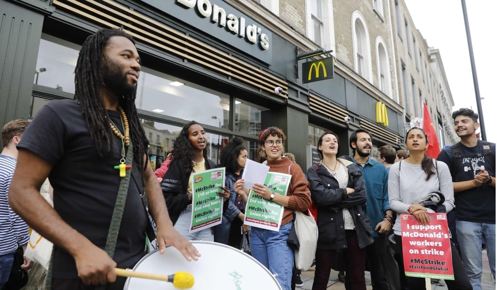 Protesters outside one of the fast-food chain's outlets in London. Photo: AFP